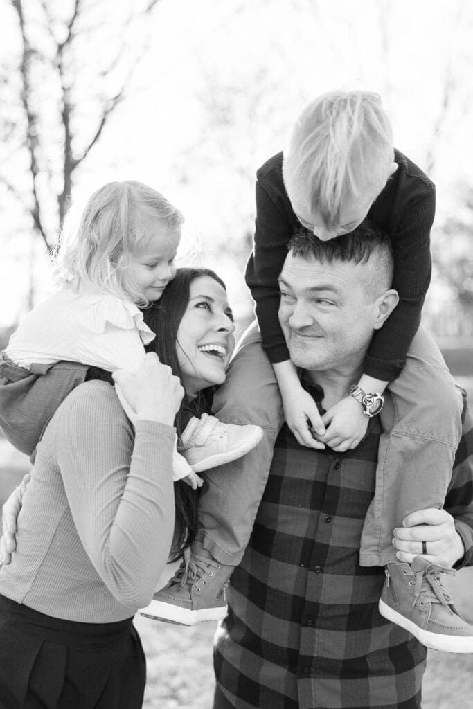 Kids on parents shoulders