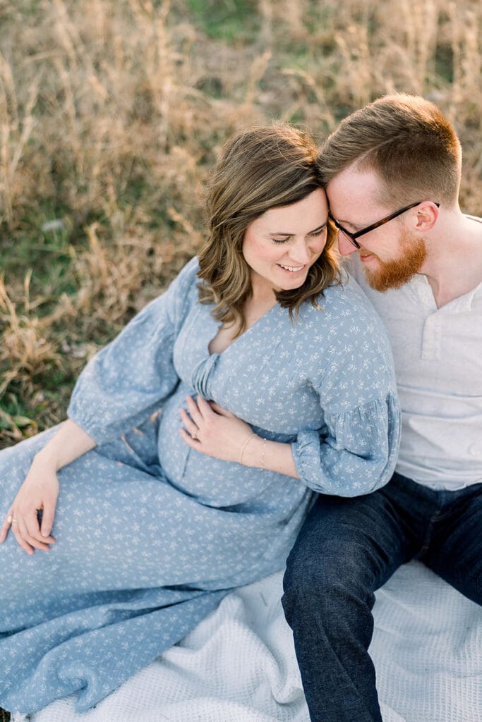 Expecting mother sitting next to husband